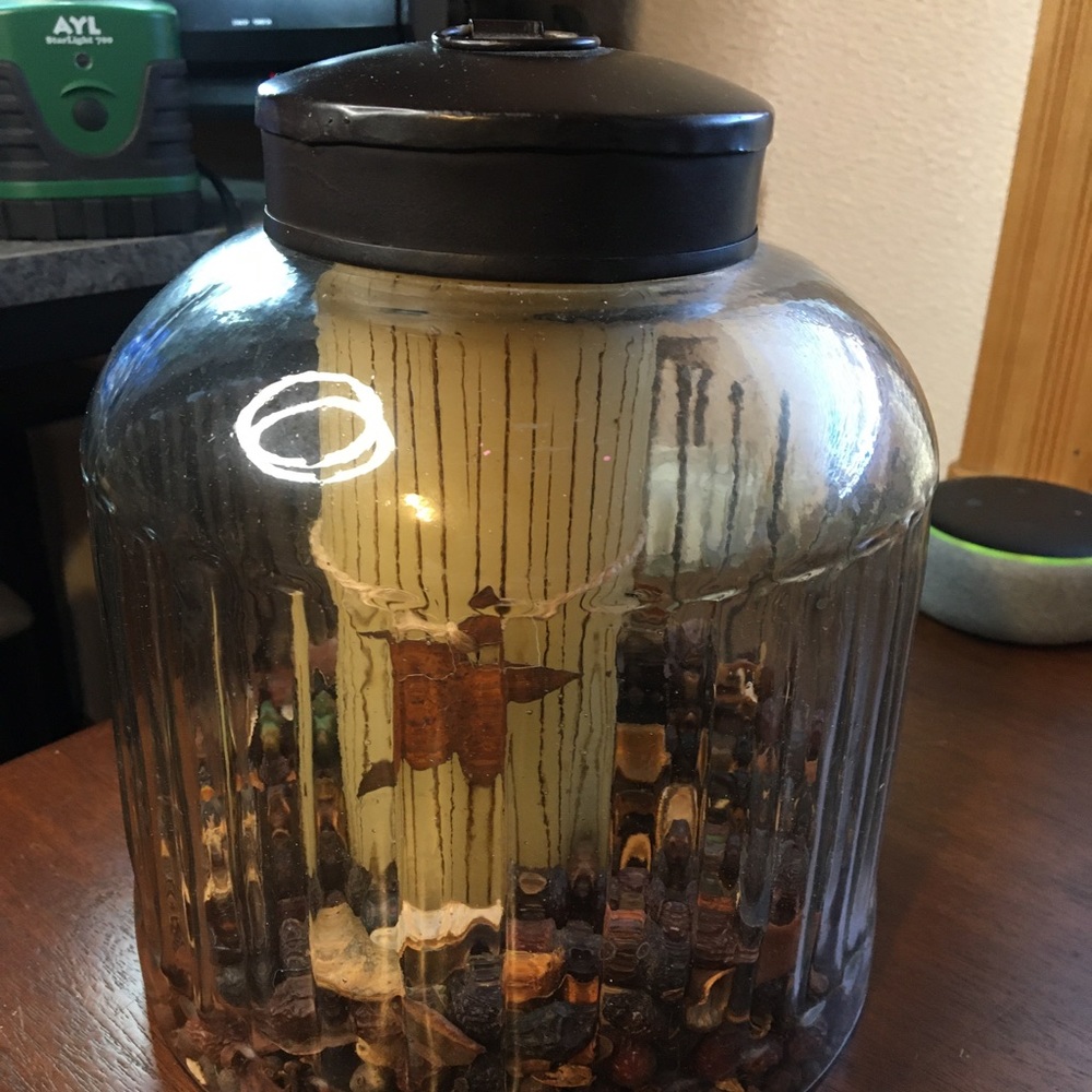 Rustic Primitive Glass jar filled with scented rose hips and a candle